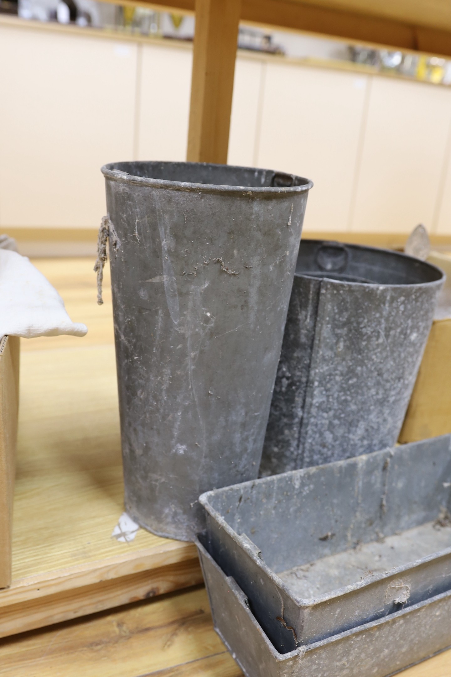 A mixed collection of galvanised troughs and wares